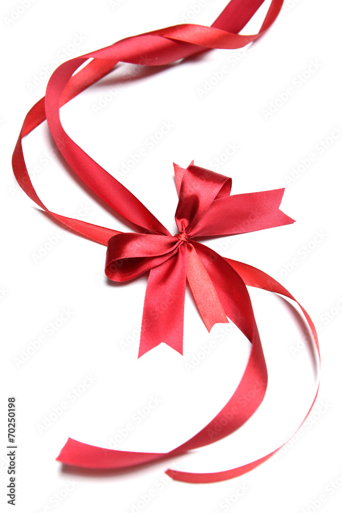 Shiny red ribbon with bow isolated on white Shiny red ribbon with bow isolated on white