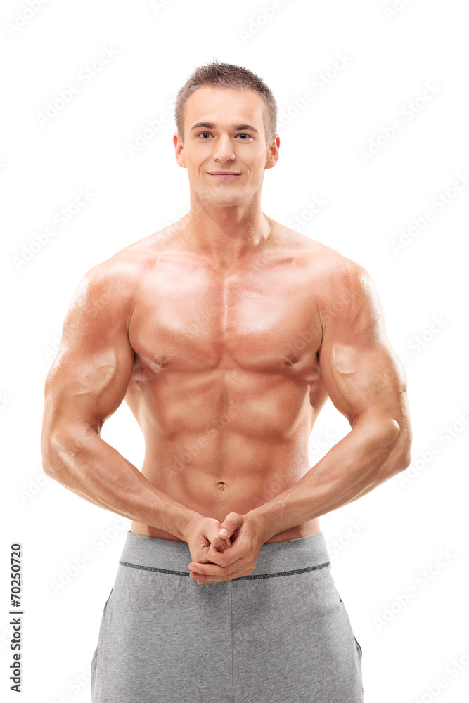 Young male bodybuilder flexing his muscles Young male bodybuilder flexing his muscles