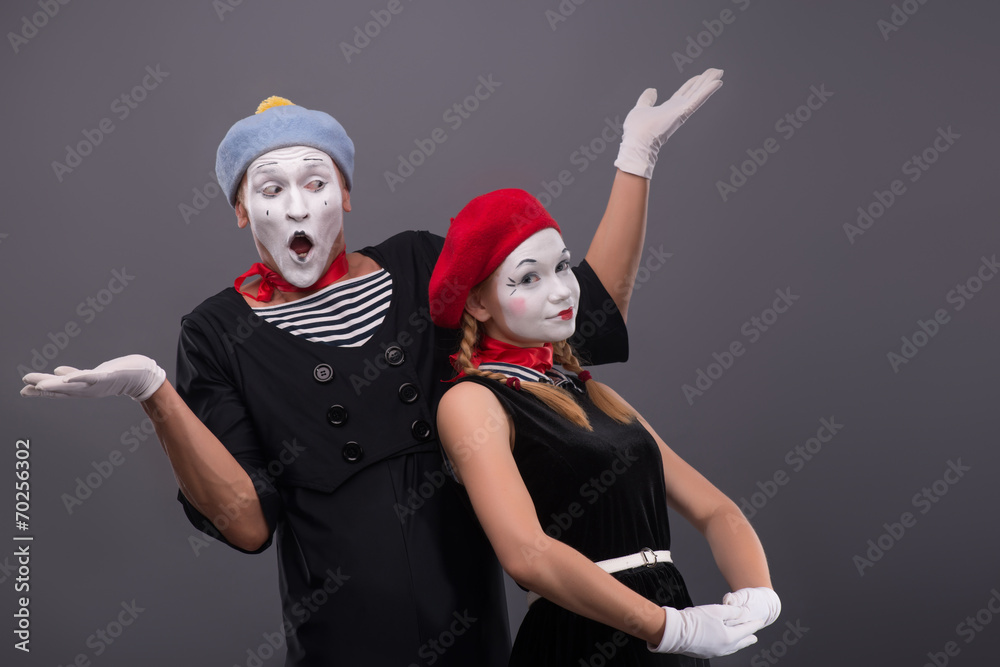 Portrait of funny mime couple with white faces and emotions isol