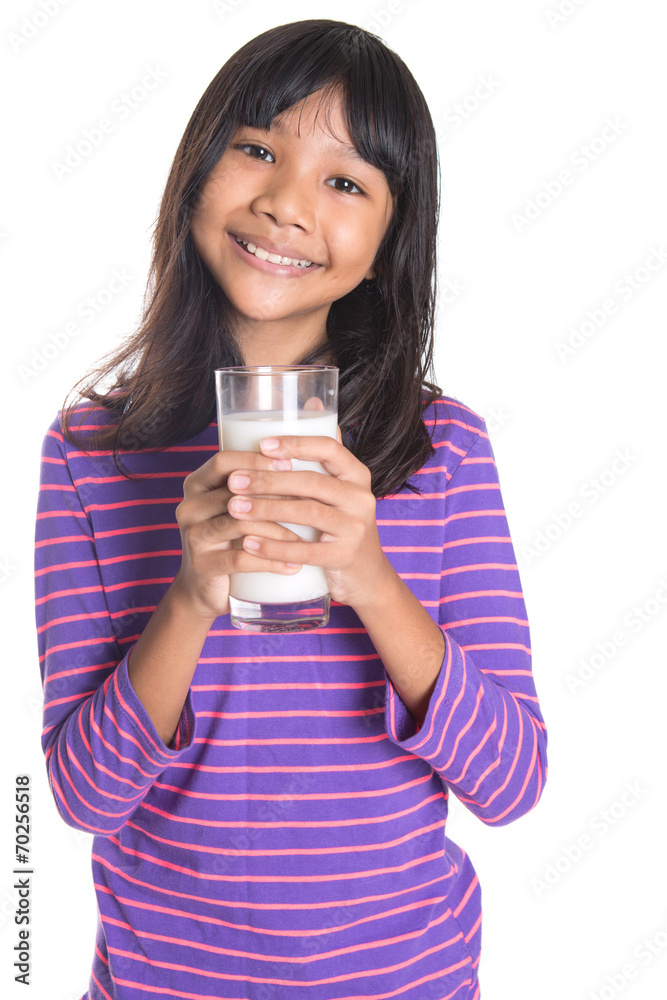 Young Asian preteen girl with a glass of milk Young Asian preteen girl with a glass of milk