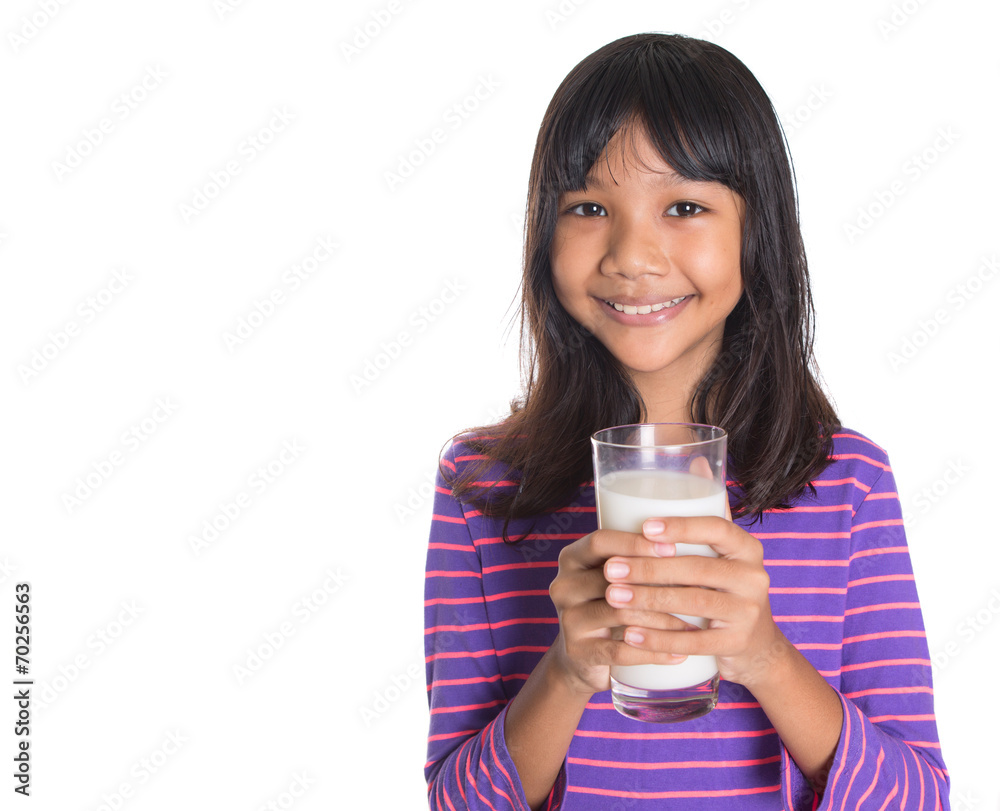 Young Asian preteen girl with a glass of milk Young Asian preteen girl with a glass of milk