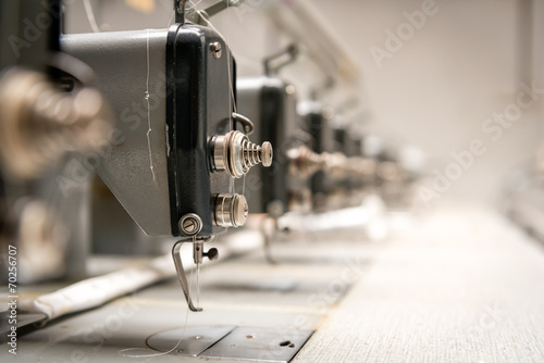 Abandoned textile factory - sewing machines photo