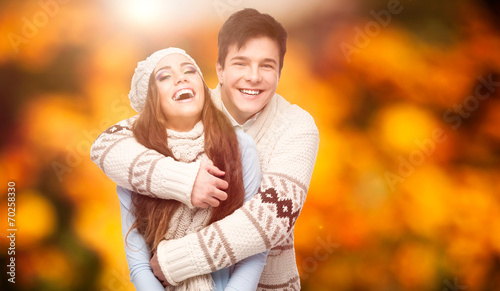 happy young couple over autumn background