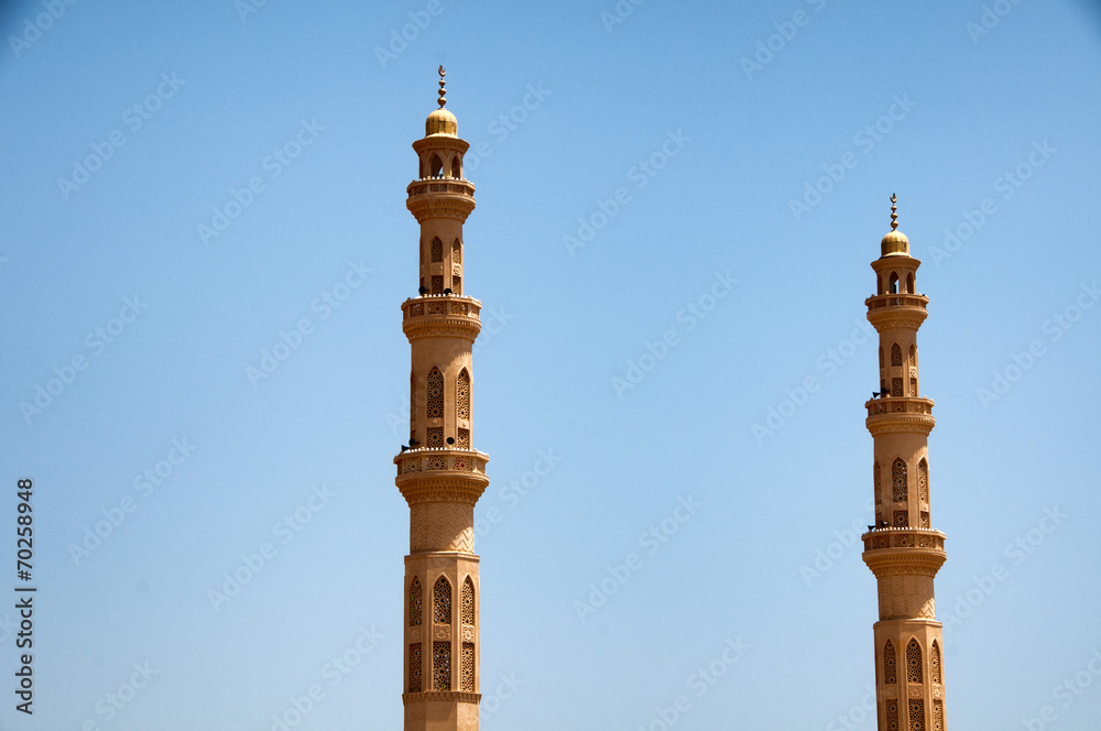 El Mina Masjid Mosque Minarets Against Blue Sky