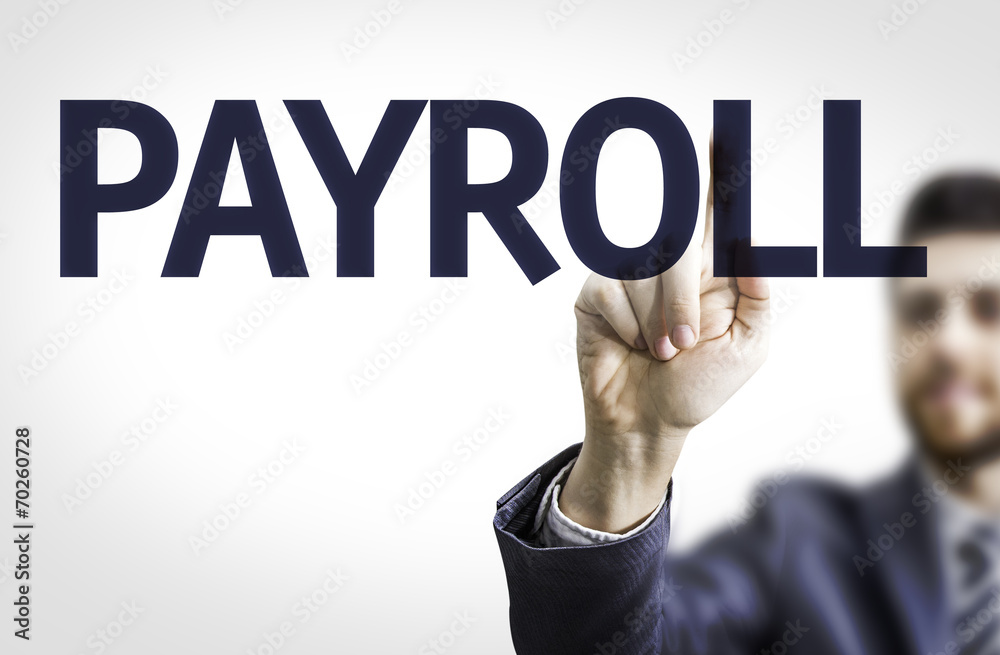 Business man pointing to transparent board with text: Payroll Business man pointing to transparent board with text: Payroll