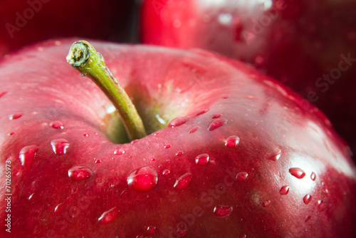 Macro shot of red apple with drops of water