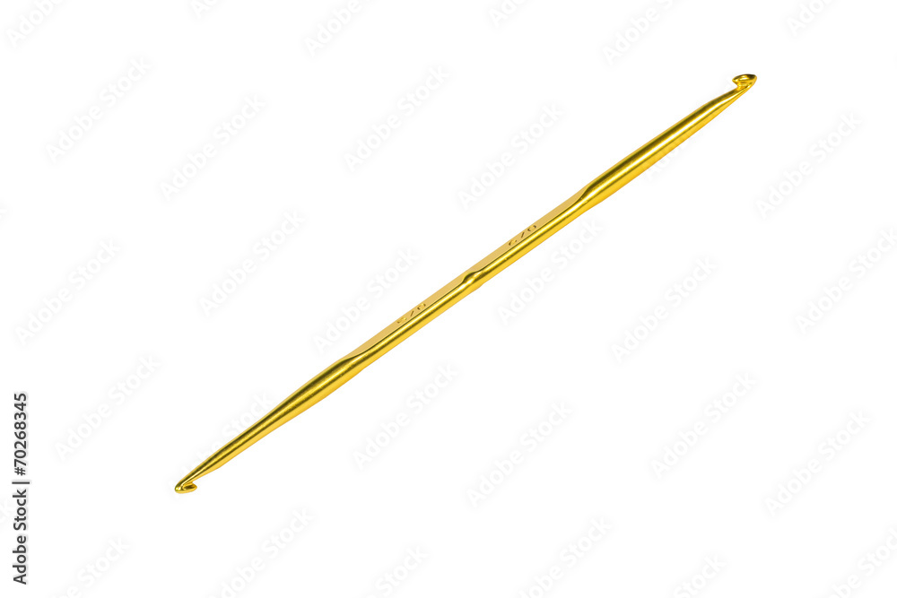 Golden crochet hook isolated on white Golden crochet hook isolated on white
