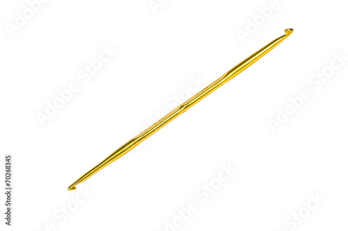 Golden crochet hook isolated on white