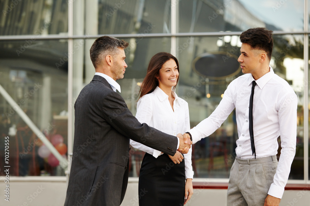 Business Team. People shake hands communicating with each other Business Team. People shake hands communicating with each other