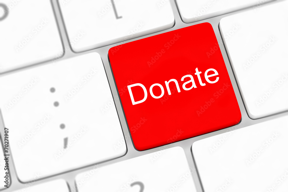 Fototapeta premium donate key word on computer keyboard,