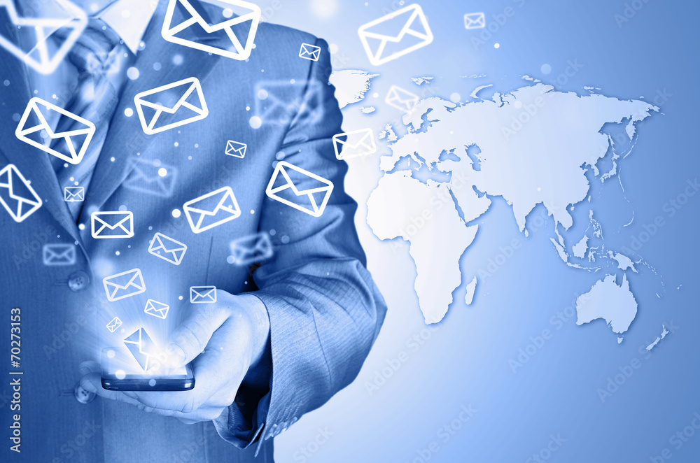Business man holding smart phone and sending emails Business man holding smart phone and sending emails