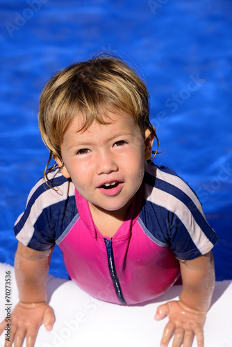 Happy kid in the swimming pool