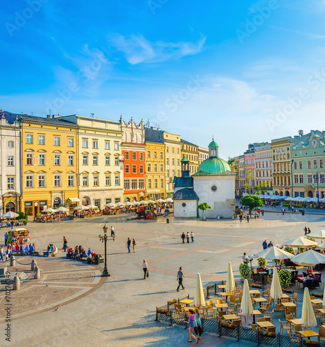 Colorful houses and small church on market square Krakow Poland photo