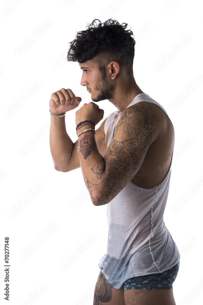 Handsome sporty man in a boxing pose. Handsome sporty man in a boxing pose.
