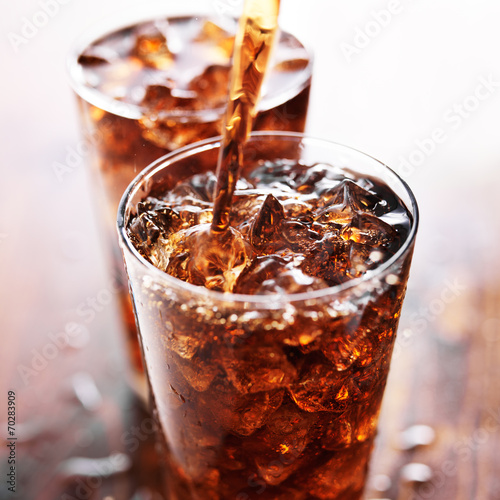 soft drink being poured into glass