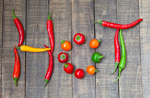 Hot chili peppers on wooden...
