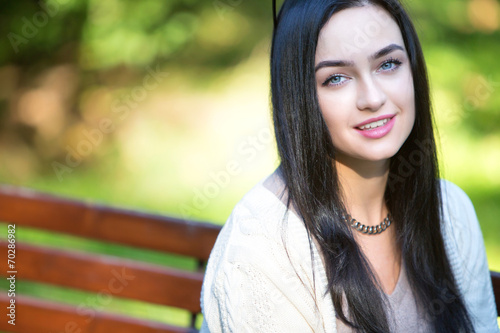 Portrait of a beautiful young girl in park