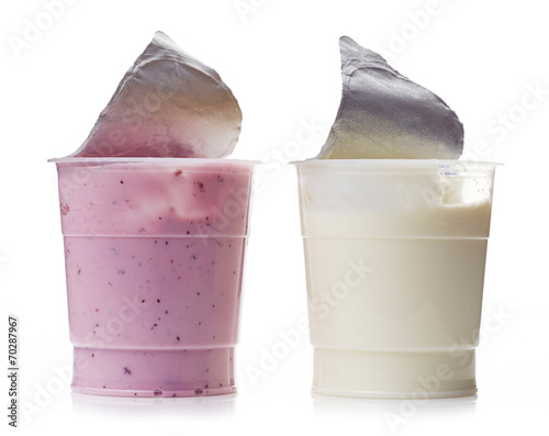 two various plastic yogurt pots on a white background