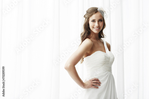 Young bride in wedding dress, studio shot .