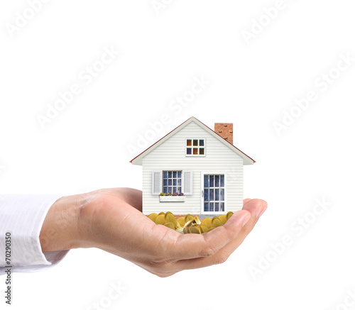 holding house and coins