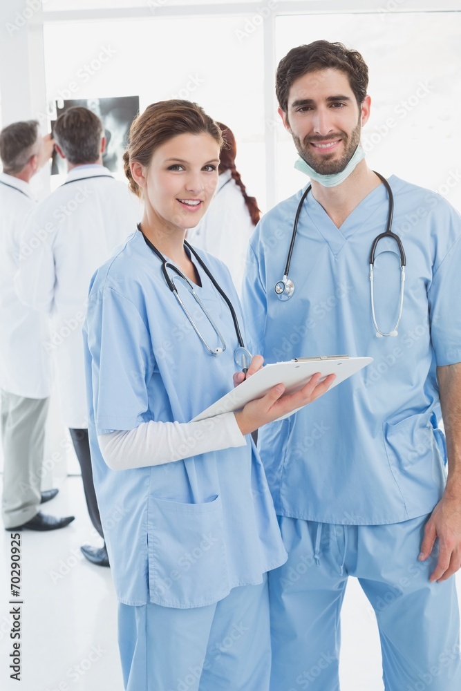 Nurses holding a file together