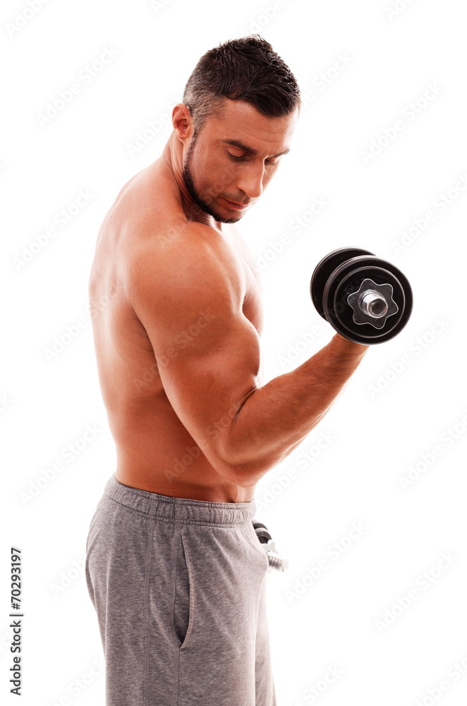 Portrait of muscular man lifting dumbbell over white background