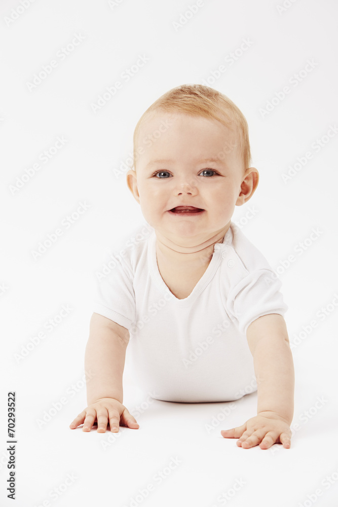 Young baby girl crawling on front, studio. Young baby girl crawling on front, studio.