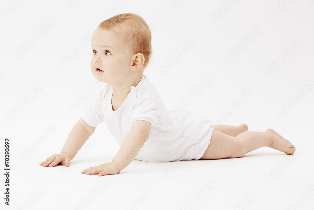 Young baby girl crawling on front, studio. Young baby girl crawling on front, studio.
