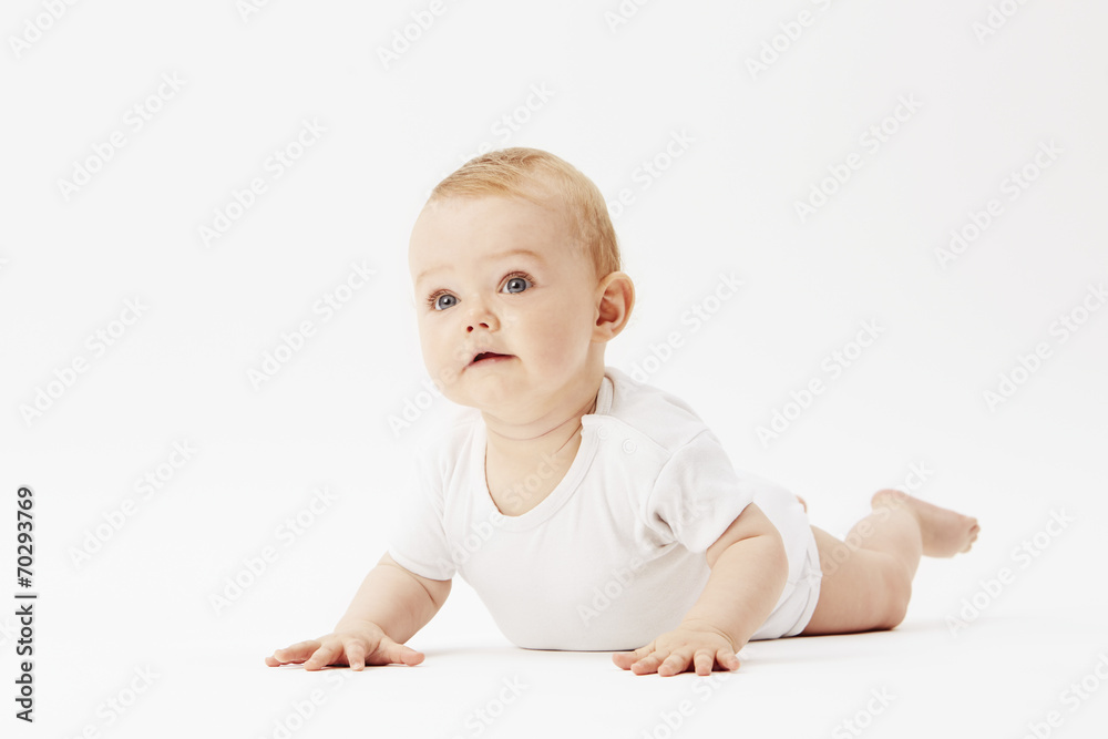 Young baby girl crawling on front, studio. Young baby girl crawling on front, studio.