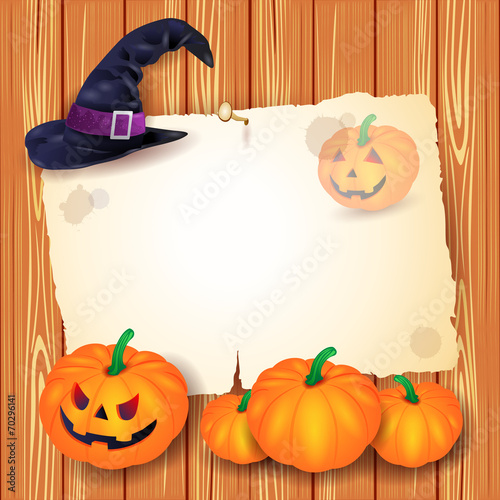 Halloween background with blank paper, hat and pumpkins