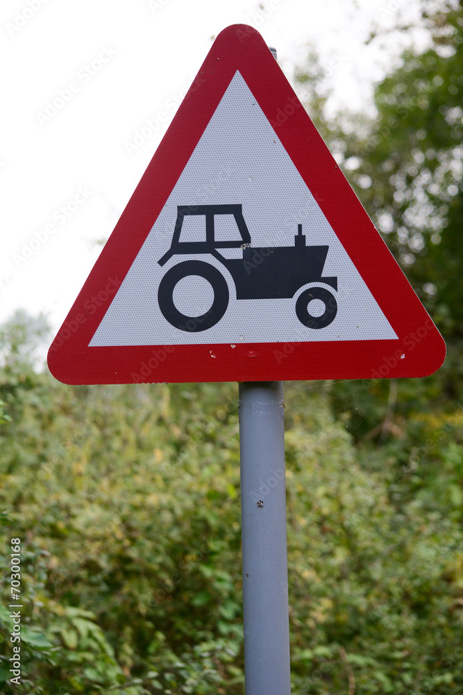 Obraz premium Tractor ahead sign and signpost
