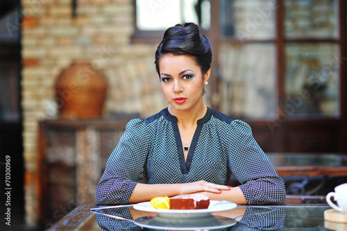 Young business woman on lunch break in cafe or restaurant