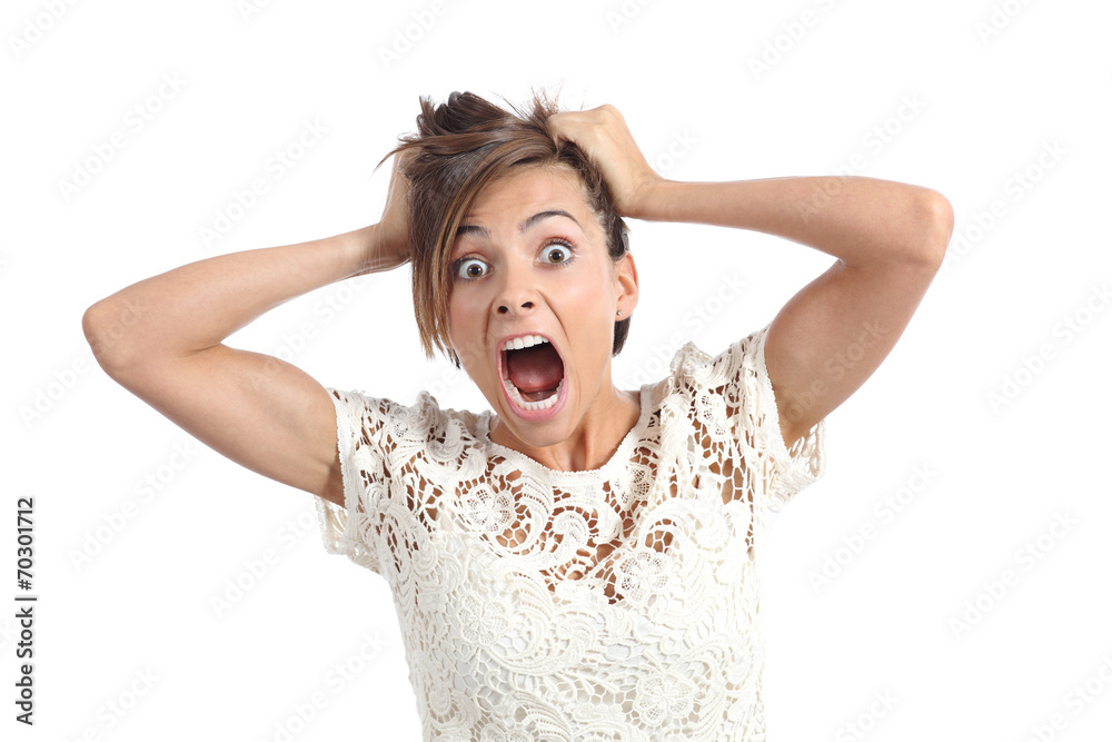 Front view of a scared woman screaming with hands on head Front view of a scared woman screaming with hands on head