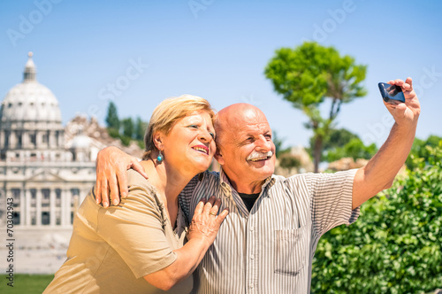 Bild auf Leinwand Senior couple taking selfie photo near St. Peter's in Rome