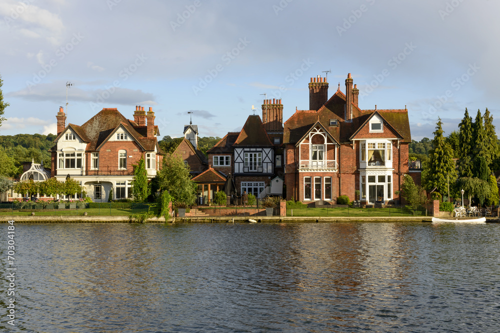 old houses and a white canoe over river Thames, Marlow old houses and a white canoe over river Thames, Marlow