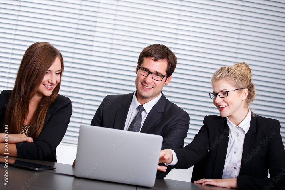 Group of happy business people in a meeting at office Group of happy business people in a meeting at office