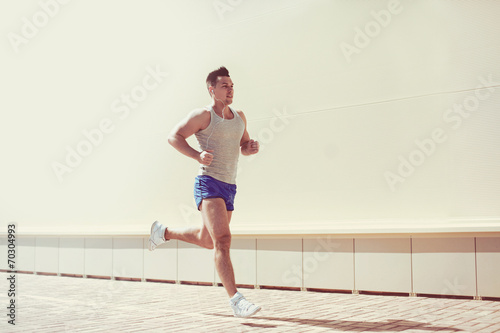 Fitness, workout, sport, lifestyle concept - man running in the