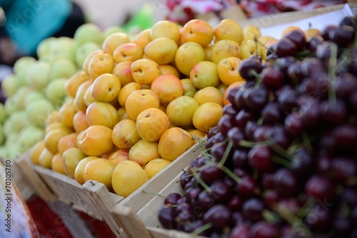 Colorful  tasty fruit in baskets at a market.