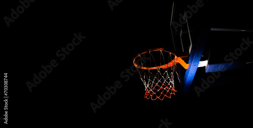 Basketball hoop on black background with light effect