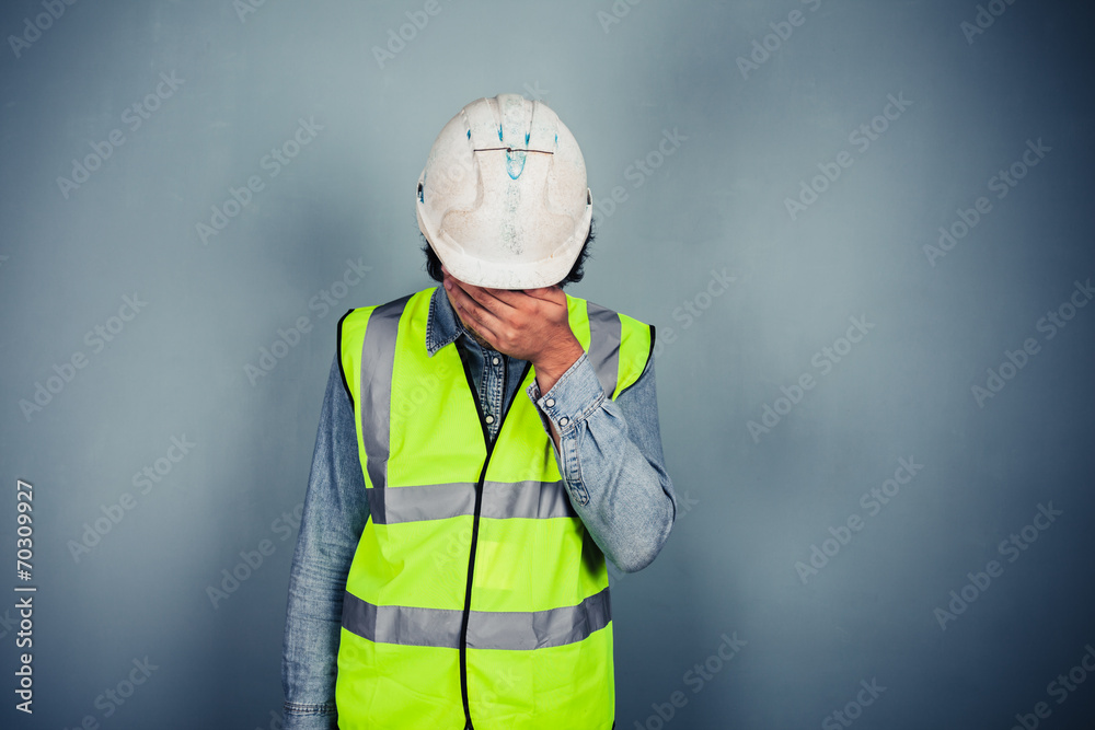 Fototapeta premium Engineer in high vis covering face