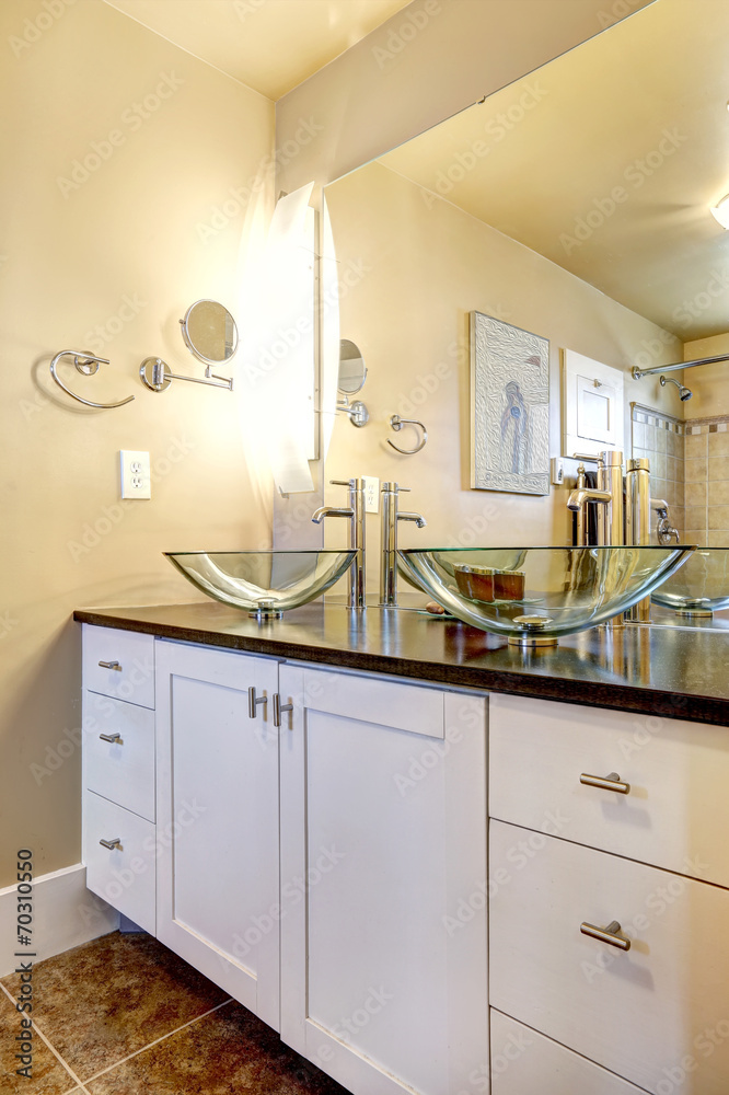 Fototapeta premium Bathroom vanity cabinet with glass vessel sinks