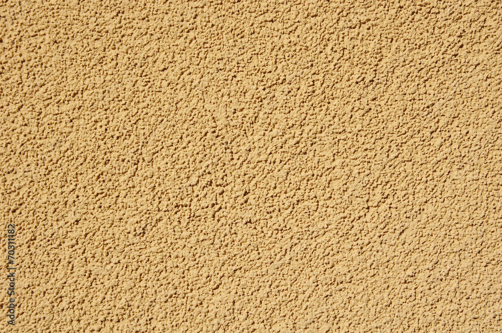 Orange relief plaster on wall closeup Orange relief plaster on wall closeup