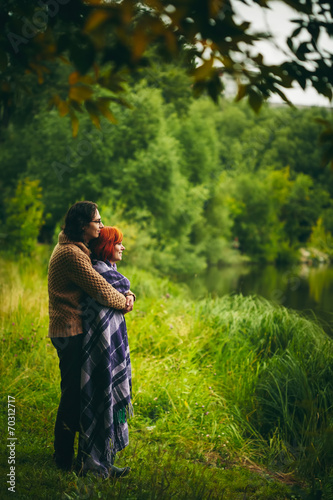 Young couple standing near water