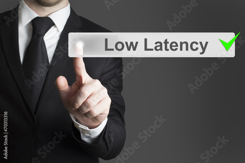 businessman pushing button low latency
