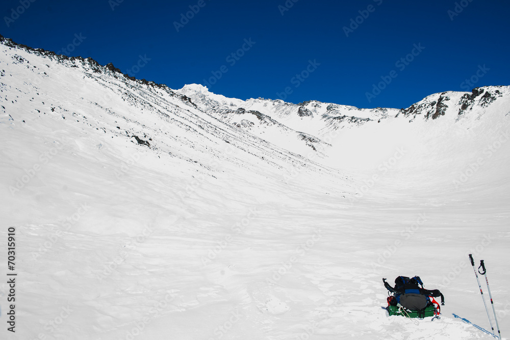 Winter landscape in the mountains with blue sky in the clouds