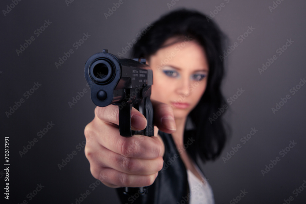 pretty girl in leather jacket with gun pretty girl in leather jacket with gun