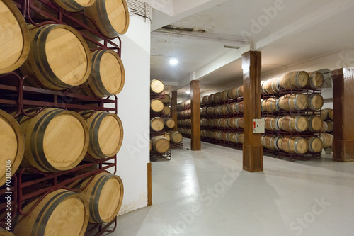   wooden barrels in  winery