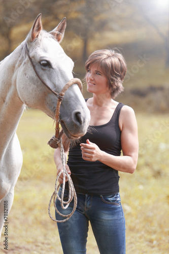Beautiful woman with a horse