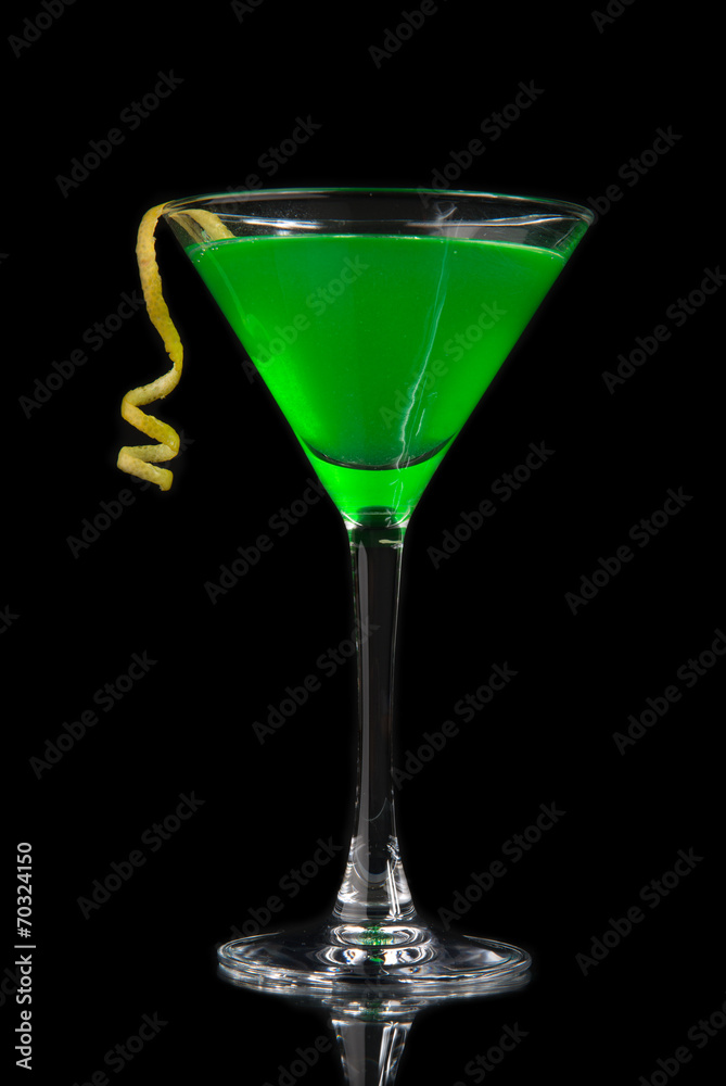Green cocktail with absinth in martini glass for halloween night