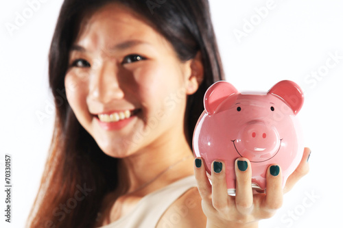 Businesswoman Holding Piggy Bank as Savings Concept